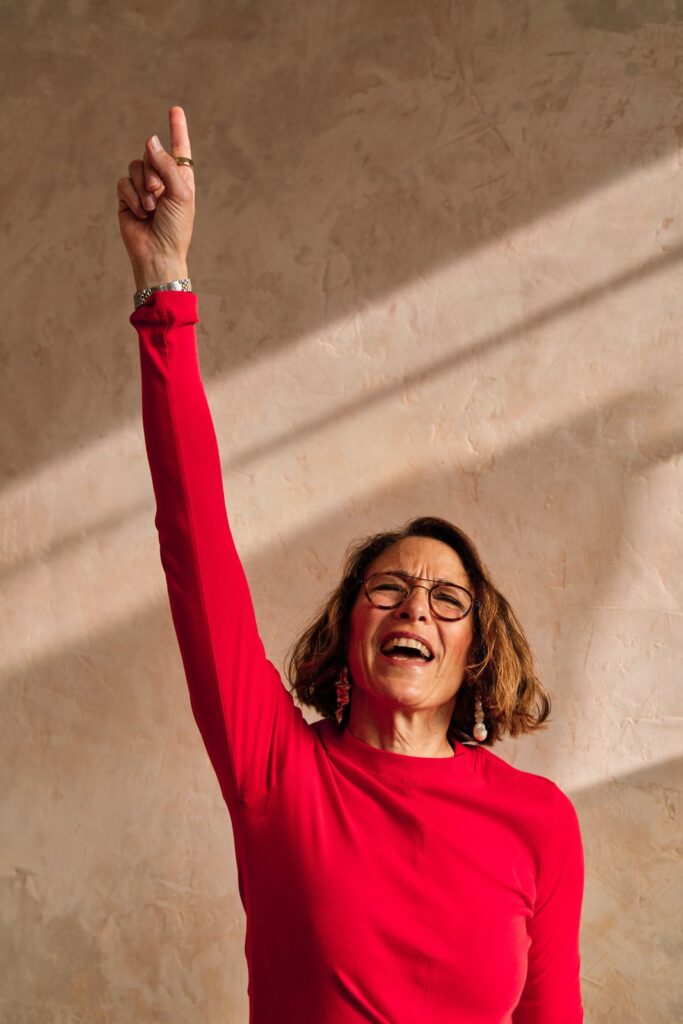 Motivational speaker dancing and singing during her brand photography session. 