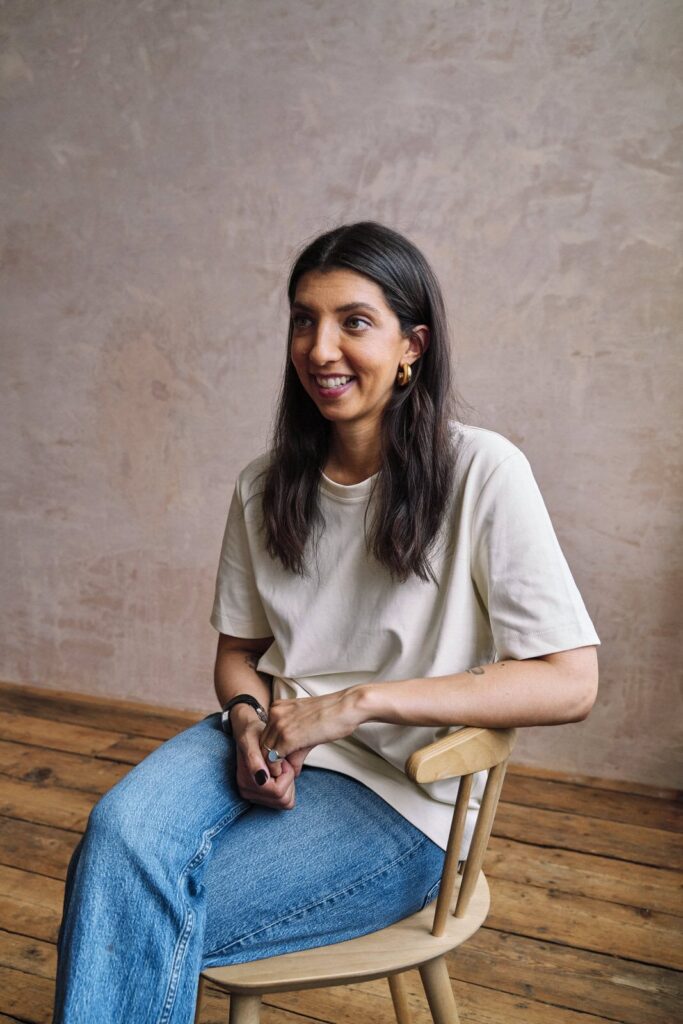 Woman wearing a simple t-shirt and jeans at her personal brand photo session. 