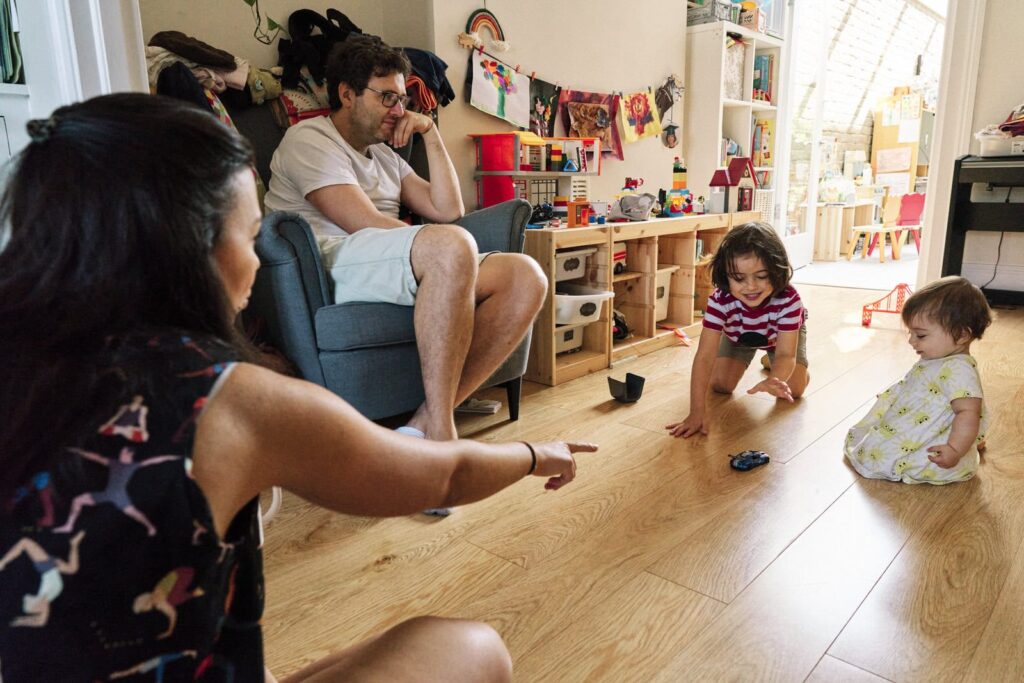 Family playing in the living room captured on photo.