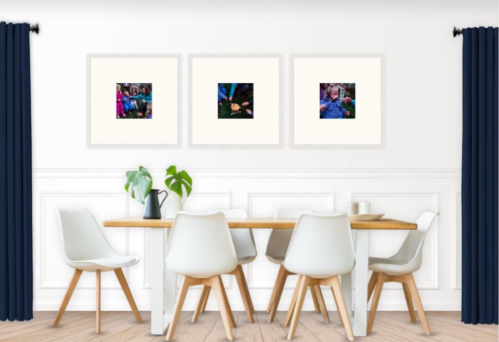 Minimalist family photo gallery wall above the dining table