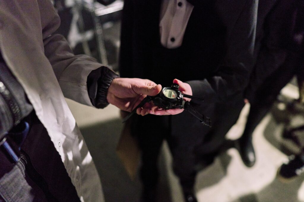 Getting a spy watch during a photo session for Make A Wish Foundation in London. 